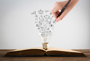 Book And Light Bulb With Hand Drawing Graph Contabilidade Digital Online | Mv On -